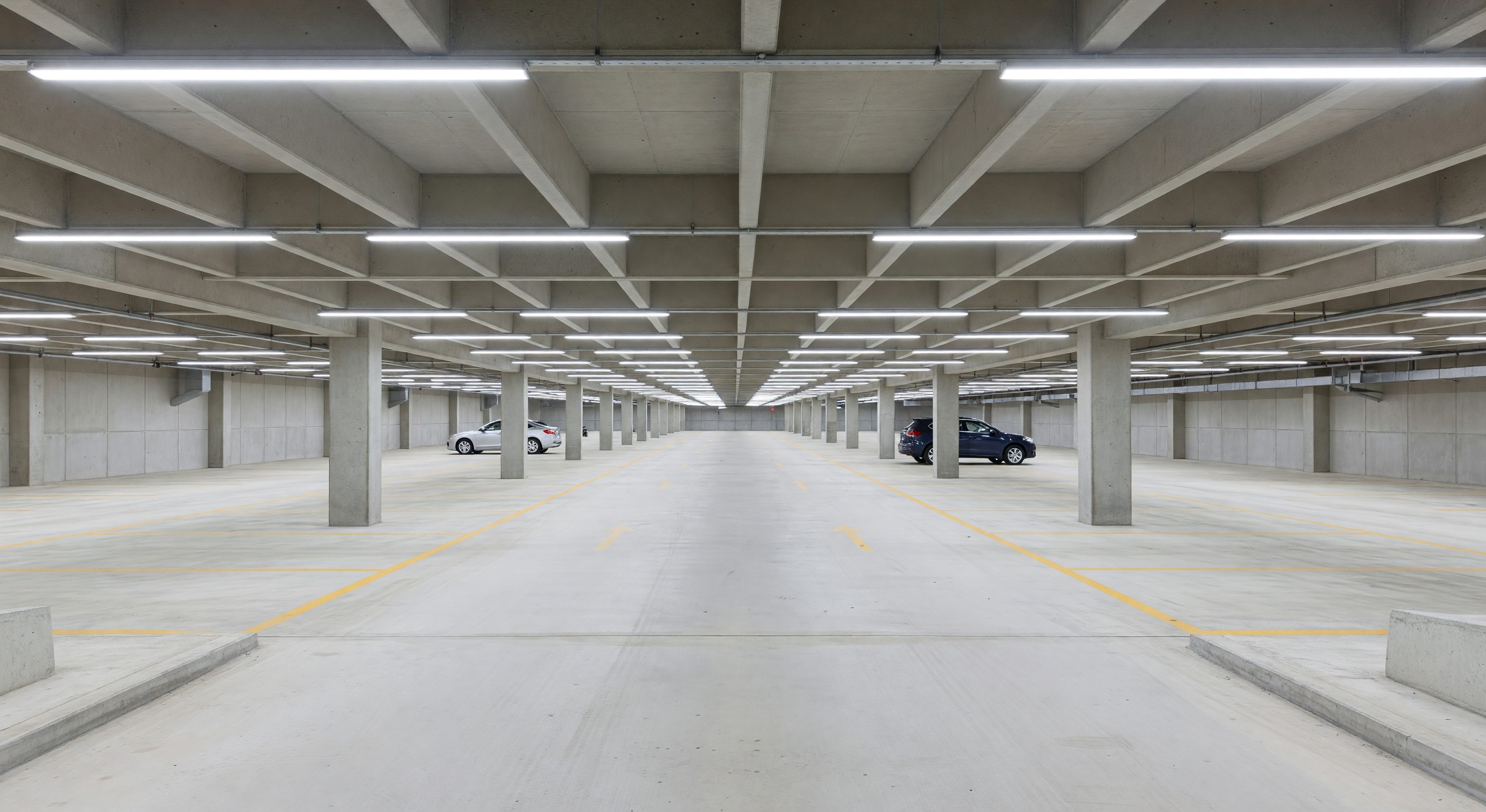 Well-lit parking structure interior showing LED lighting and uniform illumination