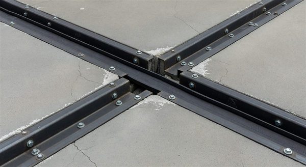 Parking structure expansion joint detail showing armored nosing and elastomeric seal