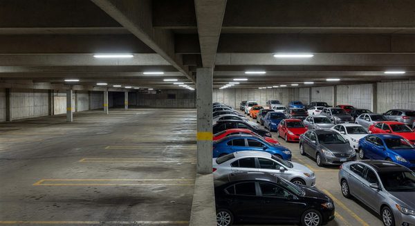 Parking garage transitioning from empty to full showing recovery